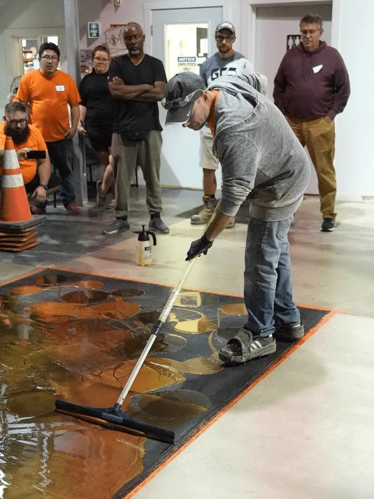 Team of epoxy flooring professionals at work on-site